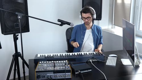 Young Man in Sound Recording Studio