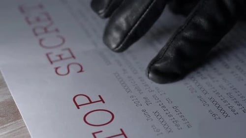 Black Gloves on a Top Secret Document