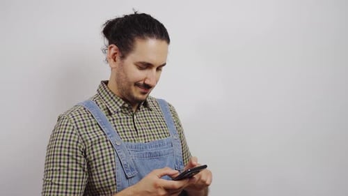 Smiling Person Using Smartphone Indoors