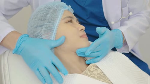 Medical Professional Examining Patient's Face in Clinic