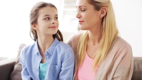 Loving Mother and Daughter Smiling at Each Other