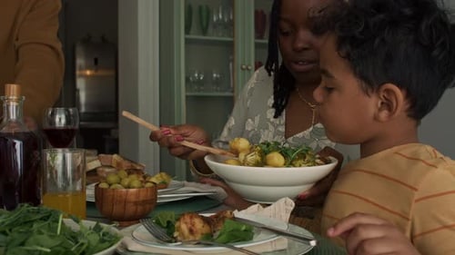 Family and Friends Sharing a Meal Together at Home