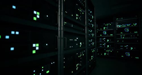 Data Center Illuminated with Colorful Lights During Nighttime Operations