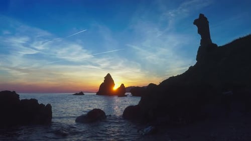 Colorful sunset at a rocky beach