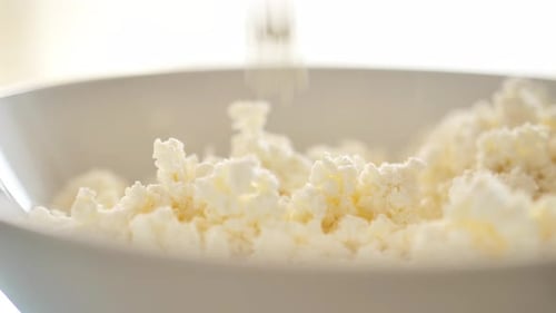 Cottage cheese granular in a white plate