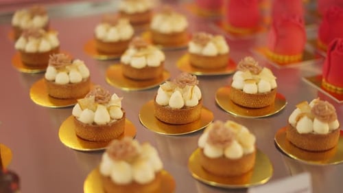 Delicious Mini Tartlets with Creamy Topping and Caramel Decorations Dessert Showcase Concept in a