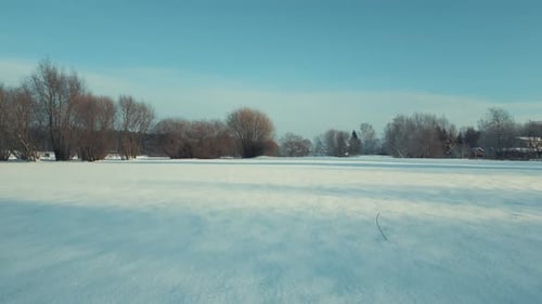 Drone Flying Near The Ground Above Snow In Winter. Cinematic Drone Winter Footage