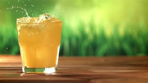 Ice Cubes Splashing into Refreshing Cold Drink