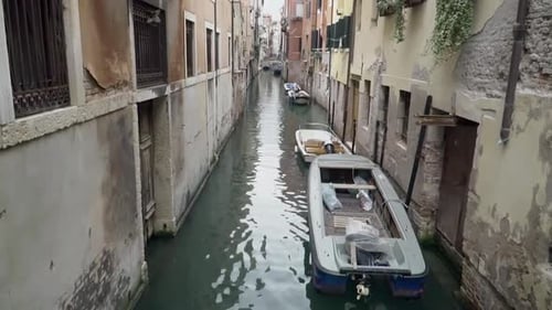 Docked boats in one of the canals in Venice Italy Tuscany