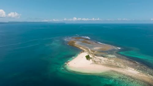Aerial Survey of Tropical Island with White Sandbar Surrounded By Water