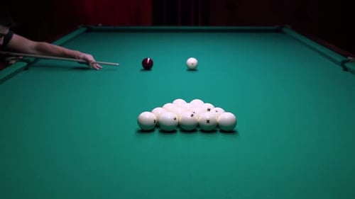 Man Breaks Ball Formation in Russian Billiards Game