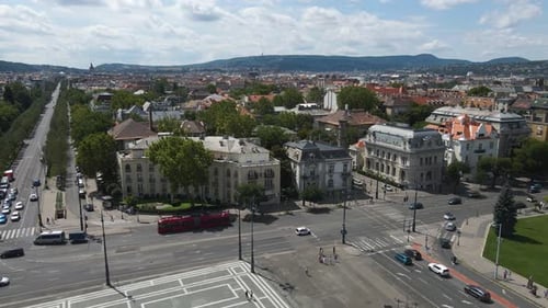 Heavy traffic circulation in front of ancient buildings in Budapest Hungary