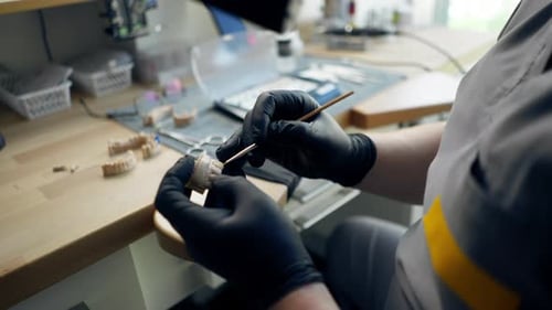 Close Up Professional Laboratory for the Production of Dental Protozoa Veneers and Crowns Male