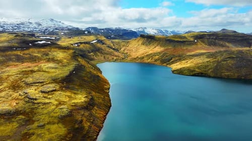 Mountain Lake Picturesque Reflection Of Clouds In Clear Glacial Water Lava Field Covered with Yellow