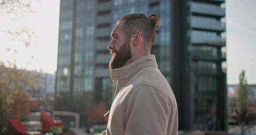 Bearded Man Gazing Out in Urban Setting