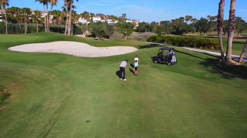 People Playing in a Luxury Golf Course in Summer