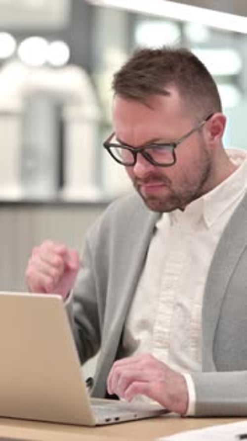 Angry Upset Creative Man Trying to Work on Laptop, vertical video