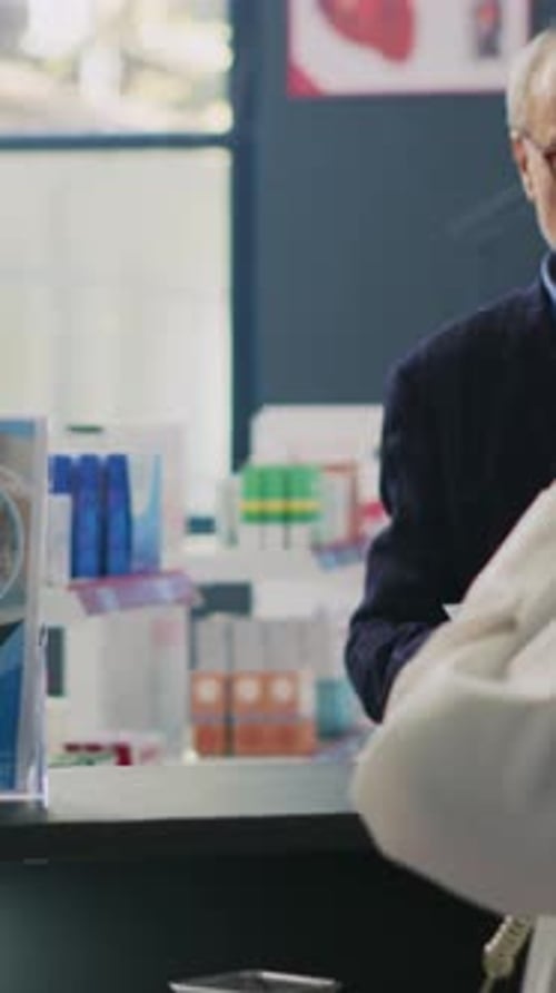 Senior Patient Discussing Healthcare With Medical Professional