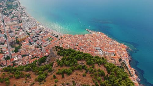 Stunning Aerial Shot of Cefalù's Historic Coastline and Vibrant Town