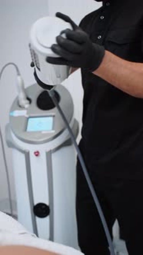 Pro Does Endospheres Therapy on Client for Anticellulite Treatment in Modern Clinic Specialist