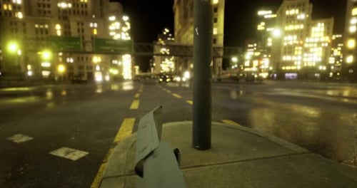City Intersection at Night with Bright Lights and Urban Atmosphere