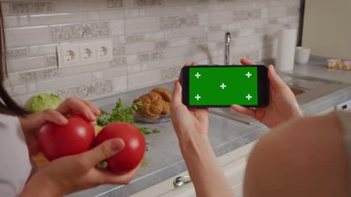 Vegetables and Smart Phone with Green Screen in Kitchen