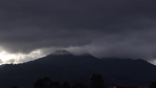 Storm grey clouds moving over mountains highlights, timelapse into the night