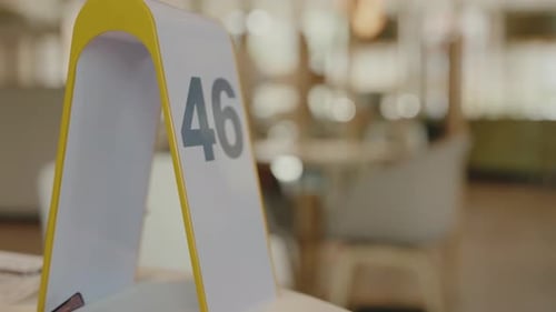Closeup on Table Stand with Number in Cafe