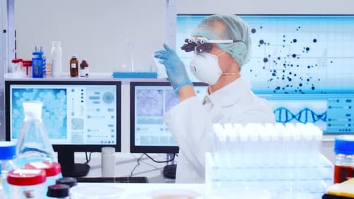 Scientist Inspecting Petri Dish in a Brightly Lit Lab