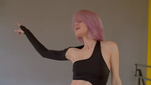 Young Woman Dances in Dance Studio