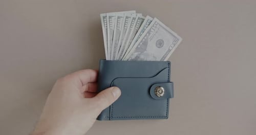 Blue Wallet Full of United States Currency