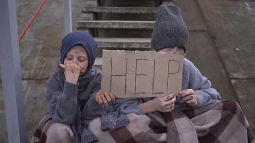 Homeless Boys Sit with Help Sign on the Stairs Eat Bread in Abandoned Place Homeless Children with a