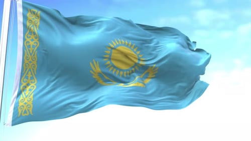 Waving Flag of Kazakhstan Against Blue Sky