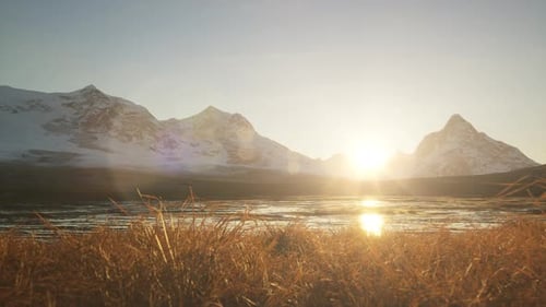 Rocky Mountain Peaks During Golden Sunrise Sky