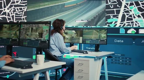 Workers Operate Futuristic Computer and Network Systems