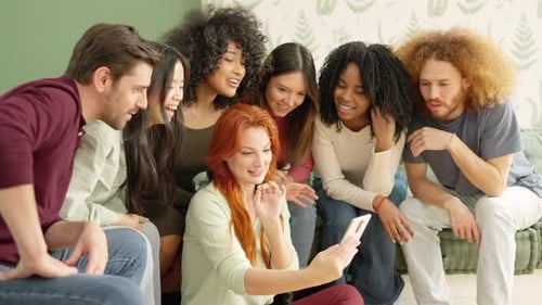 Group of Friends Laughing at Smartphone Together