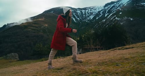 Woman in Red Jacket Climbing on Vacation Travel on Beautiful Mountain Landscape