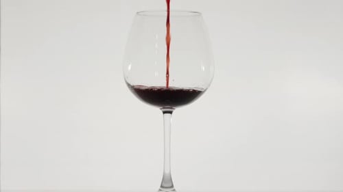 Pouring Red Wine into a Glass