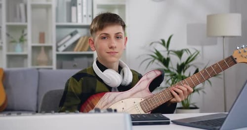 Teen Plays Electric Guitar at Home