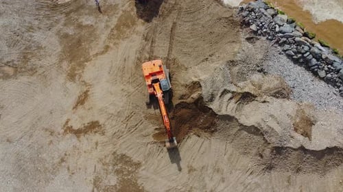 Excavator Digging on Beach, Aerial View