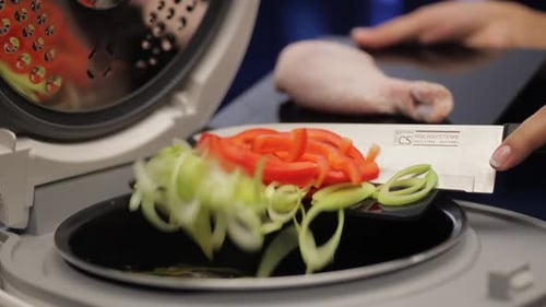 Vegetables and Raw Chicken Leg Being Prepared