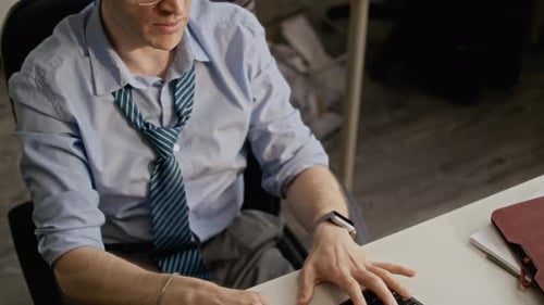 Man in Formalwear Finishing Working on Computer in Office