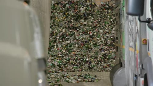 Pile of glass Bottles at a Recycling Plant.
