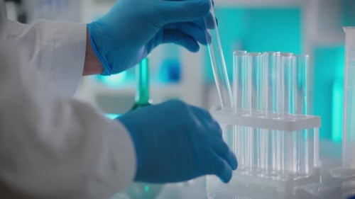Coat. A scientific researcher analyzes the composition of liquids in a scientific institute