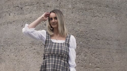 Beautiful Woman Posing in Plaid Dress