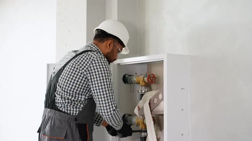 Indian Plumber Installing Fire Hydrant in Office or Home Fire Protection Systems Maintenance for