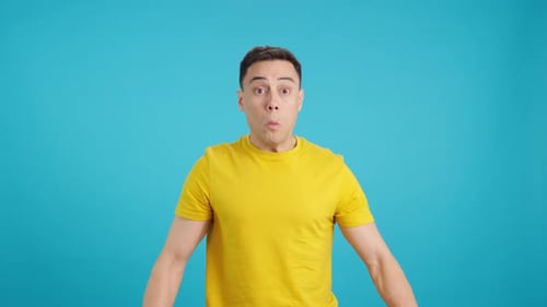 Man with Comical Expression Opening His Eyes in Astonishment