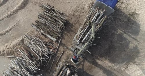 Woodworking Aerial View Recycling of Tree Trunks Unloading Logs From a Truck Wood Processing Factory