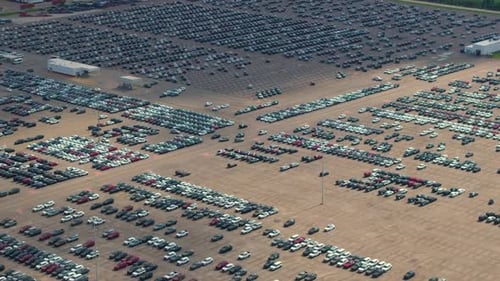 New Cars Parked for Sale on Automotive Factory Parking Lot Dealer Vehicle Inventory for Import and