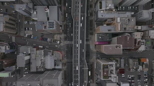 High Angle View of Traffic on Thoroughfare Leading Through Urban Borough Tall Residential Buildings